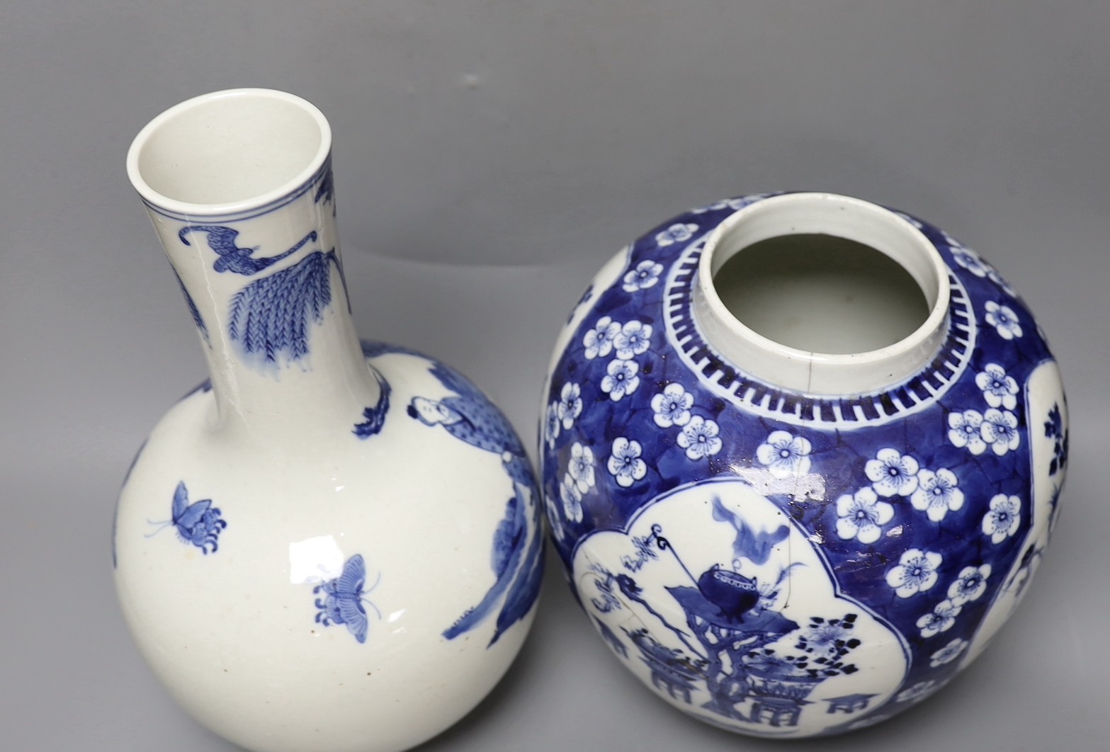 A Chinese blue and white ‘Antiques’ jar, early 20th century and a Chinese blue and white bottle vase, tallest 35cm